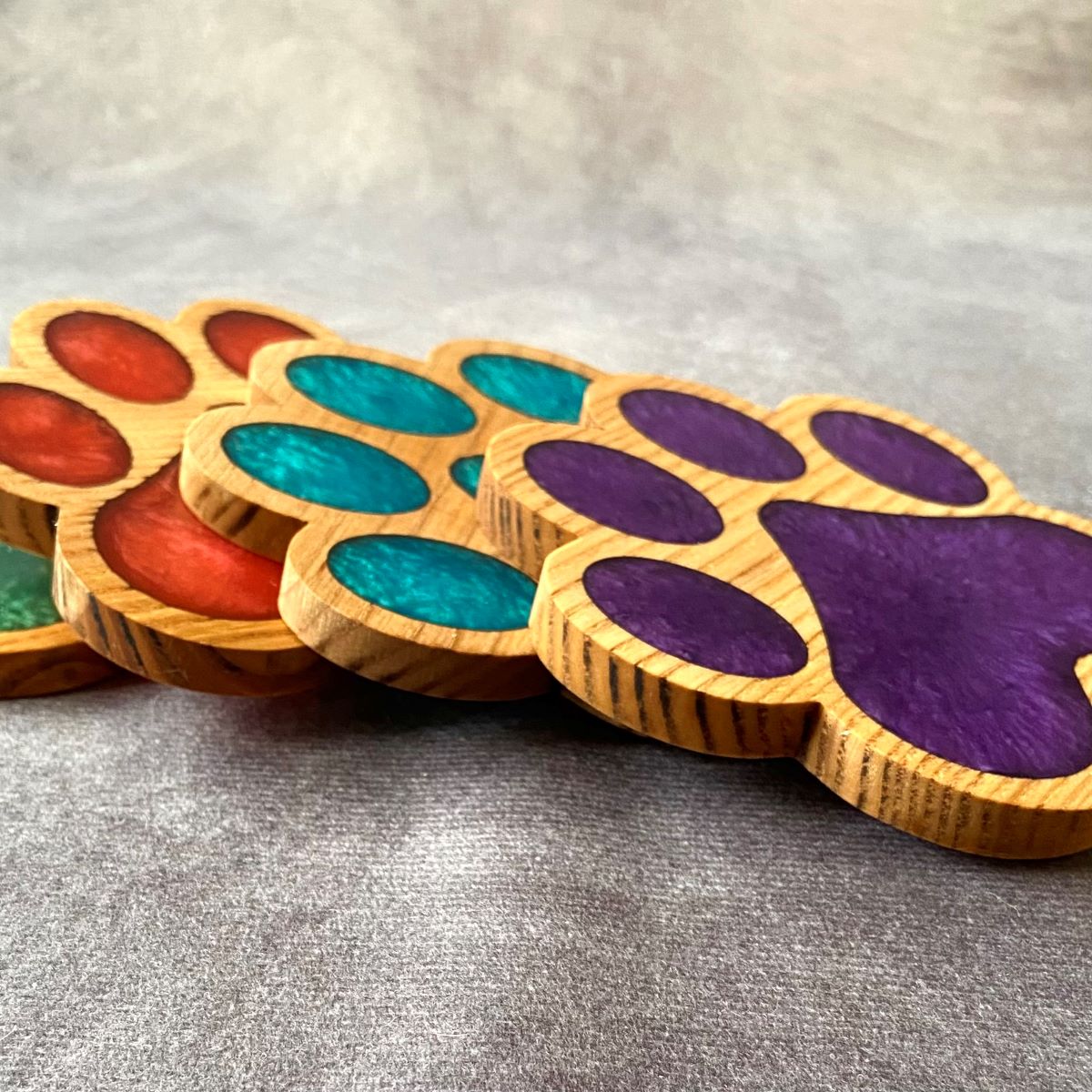 Paw print design resin coaster group picture side view