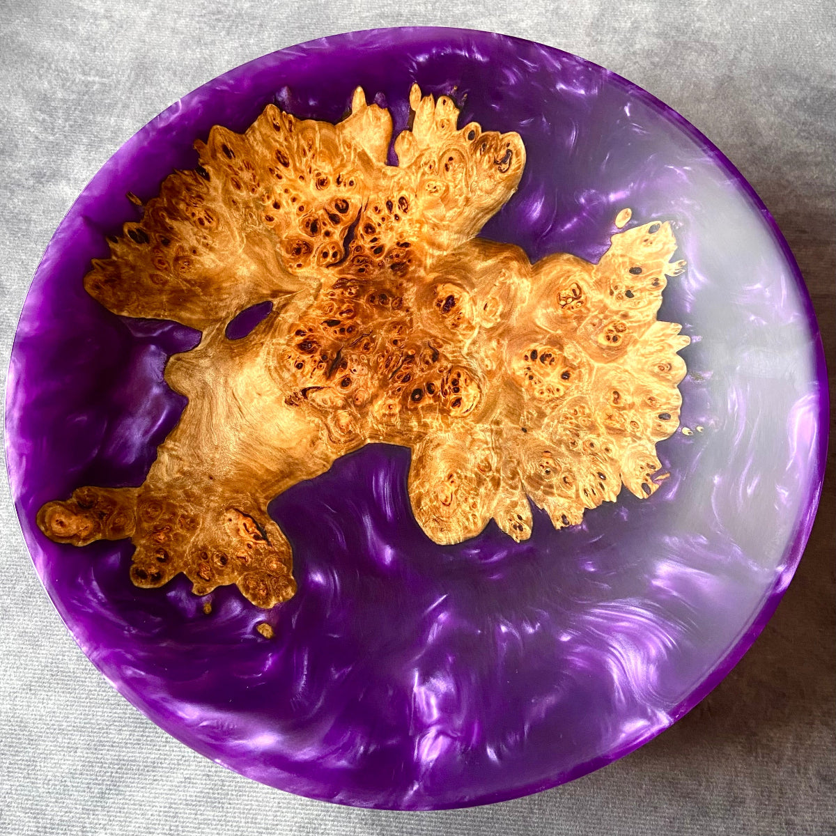 Top view of handmade large purple resin bowl with mappa burr wood – artisan epoxy and burl centerpiece showing natural grain and swirling violet resin finish.