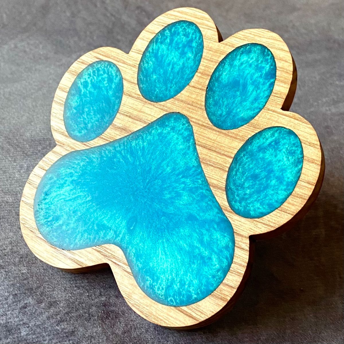 Paw print design turquoise resin coaster
