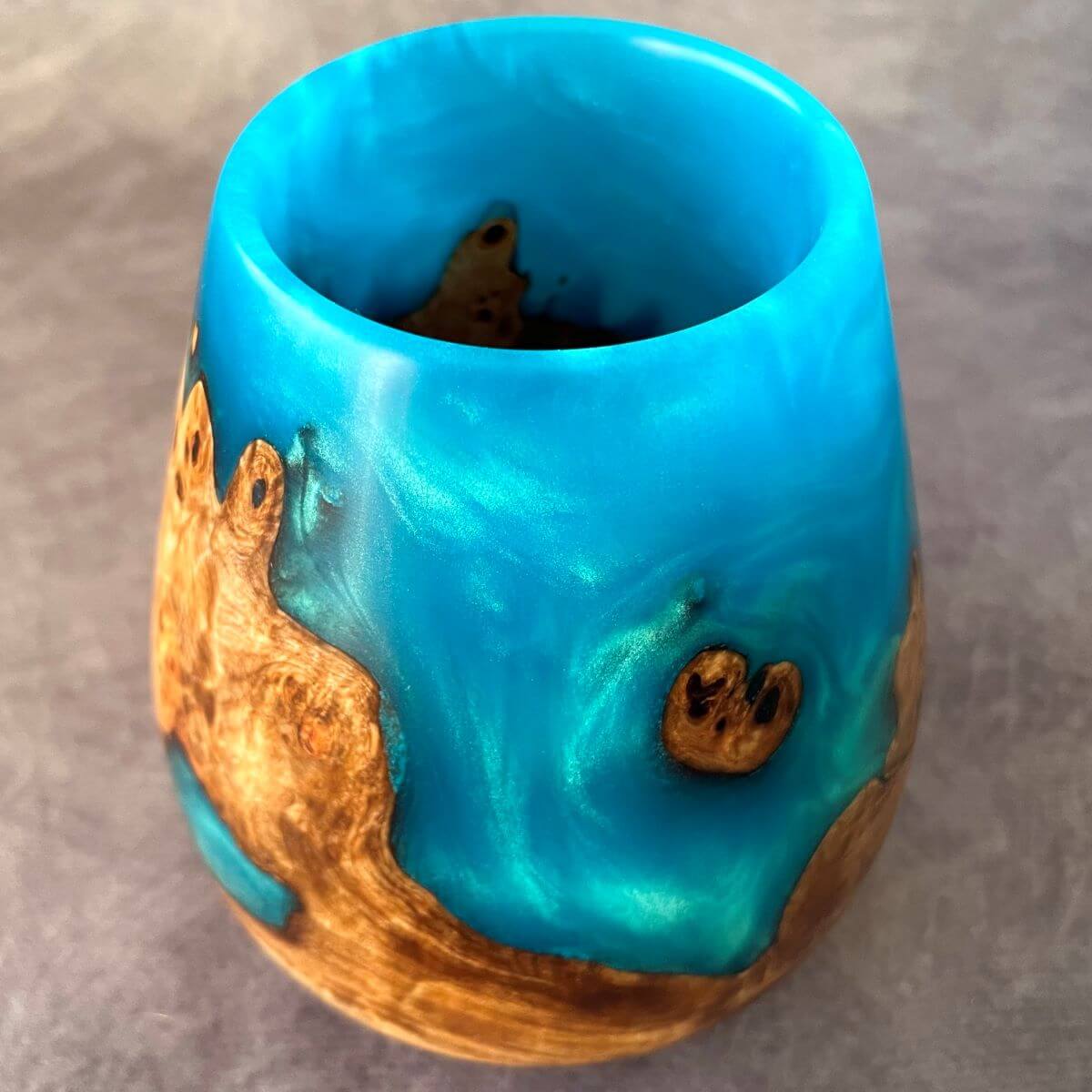 Top view of mappa and turquoise resin vase wood art sculpture