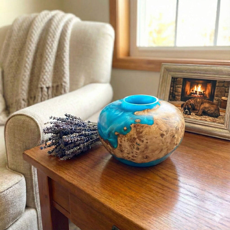 handmade burr and resin hollow form sitting on a table