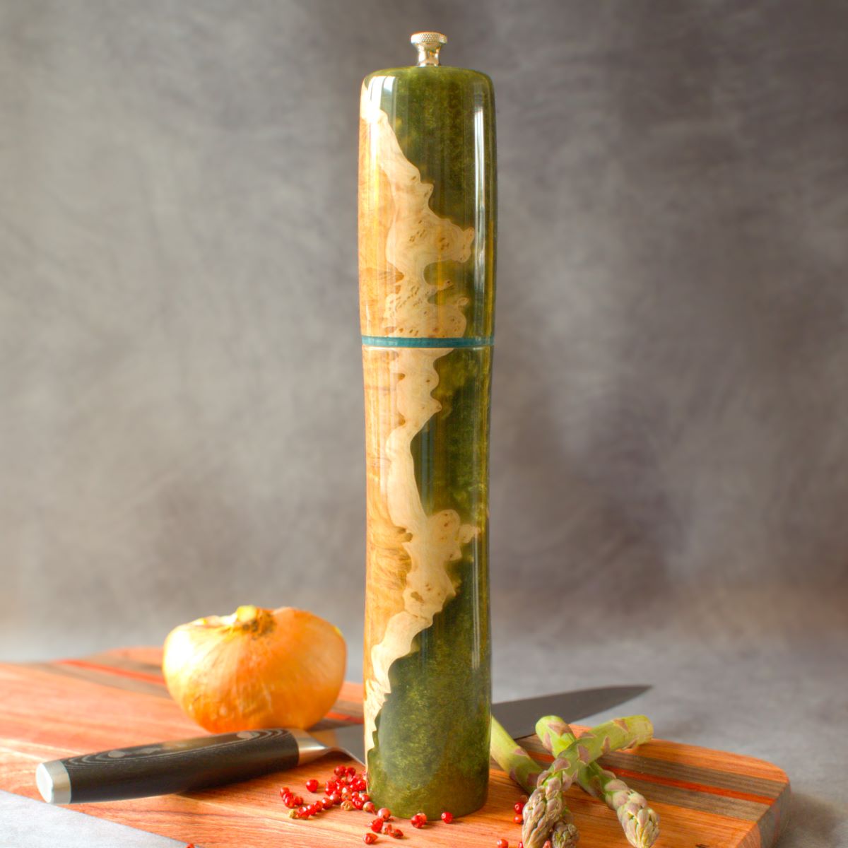 Mallee burr & green resin pepper mill on charcuterie board front view