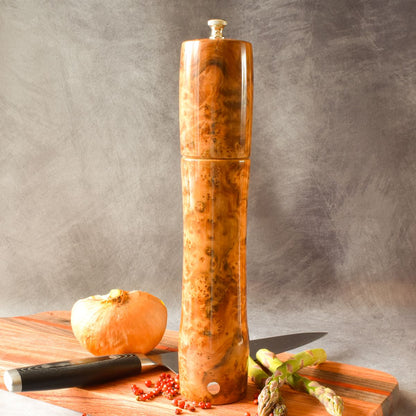 Thuya burr pepper mill on charcuterie board front view