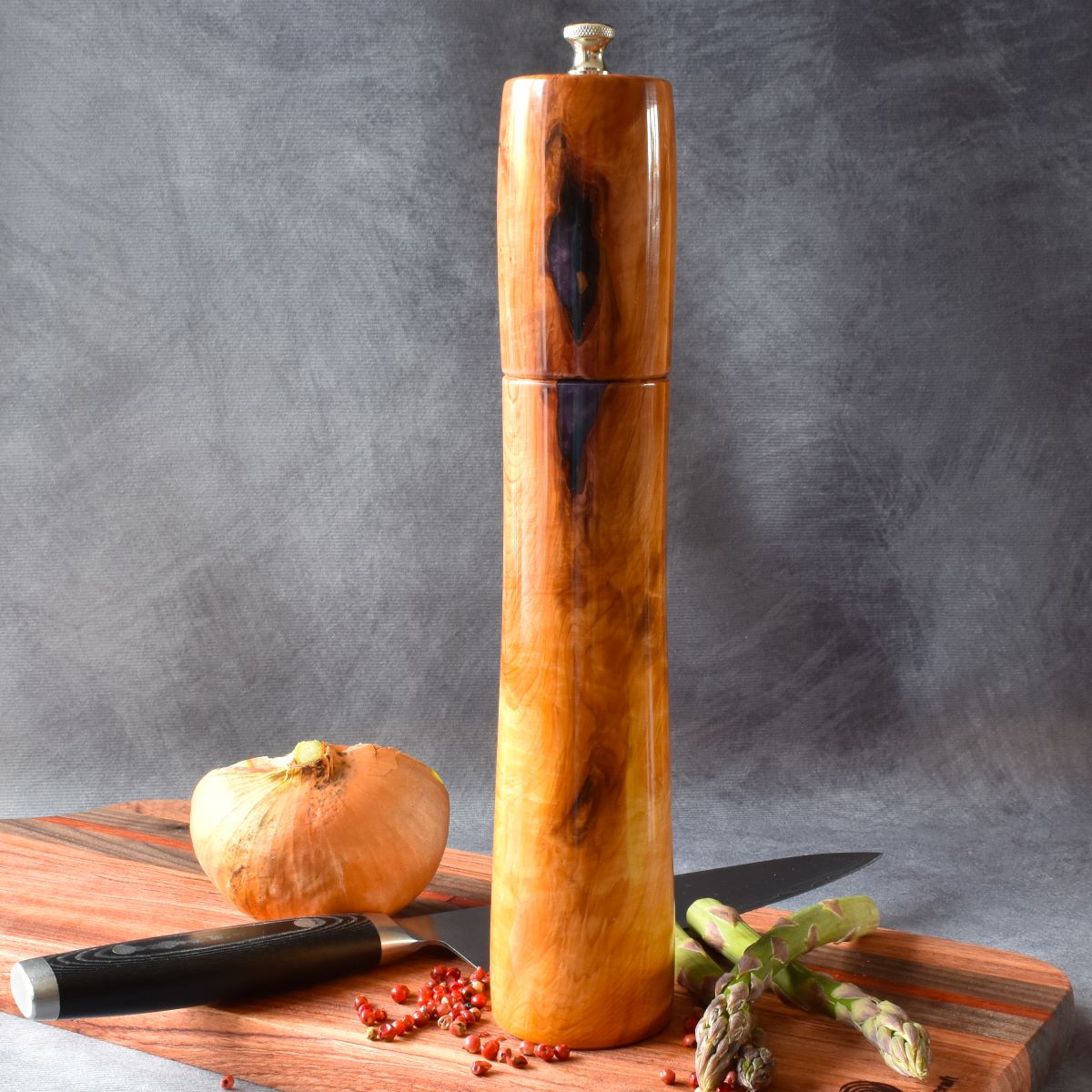 English yew pepper mill on charcuterie board front view