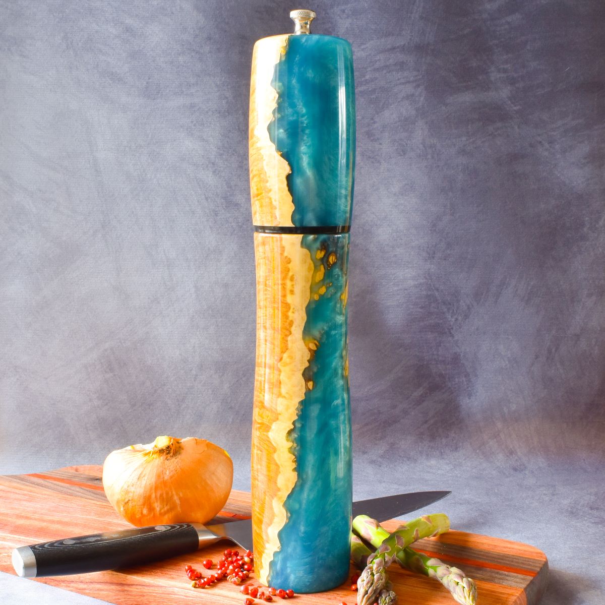 Mallee burr & turquoise resin pepper mill on charcuterie board front view