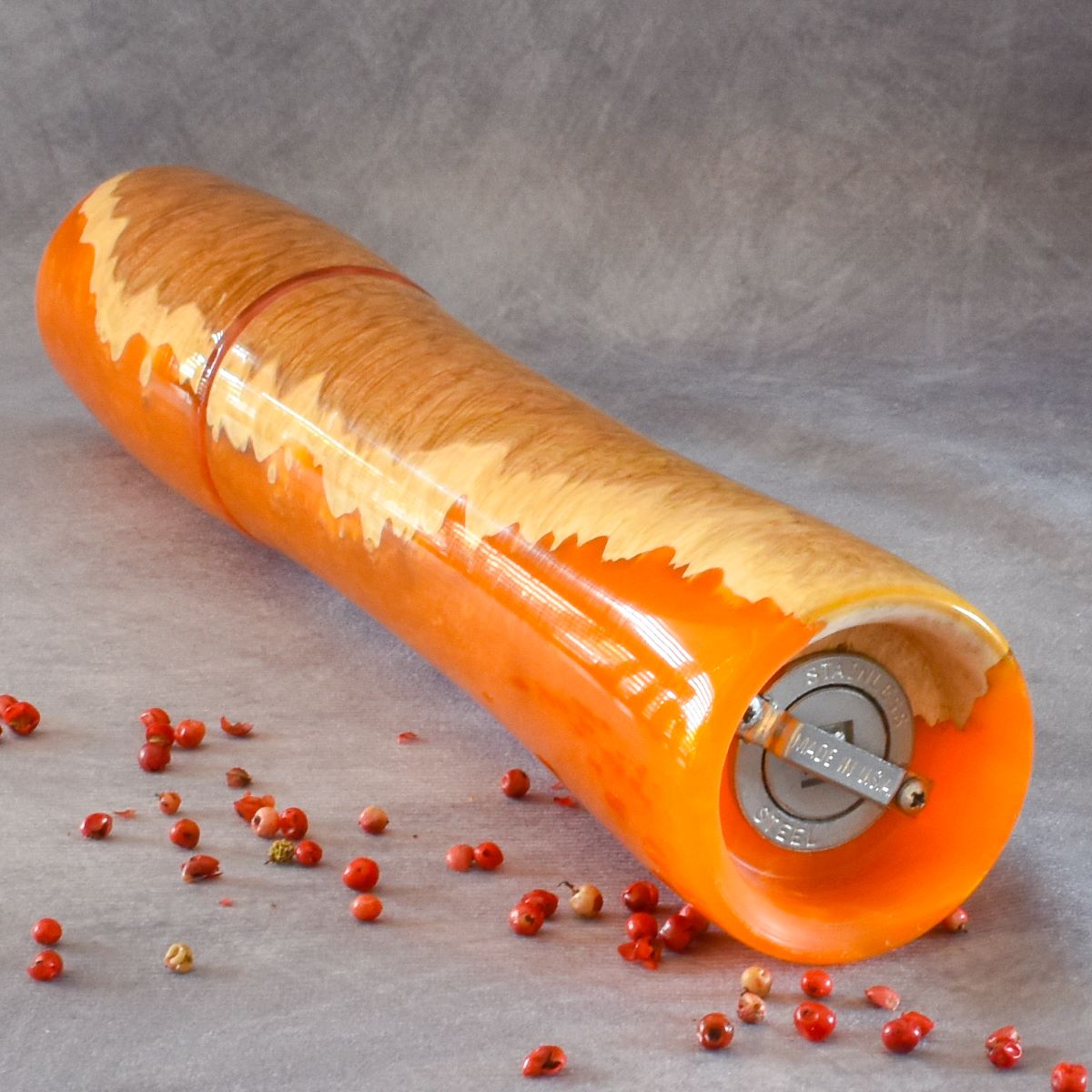 Mallee burr and orange resin pepper mill bottom view showing grinding mechanism