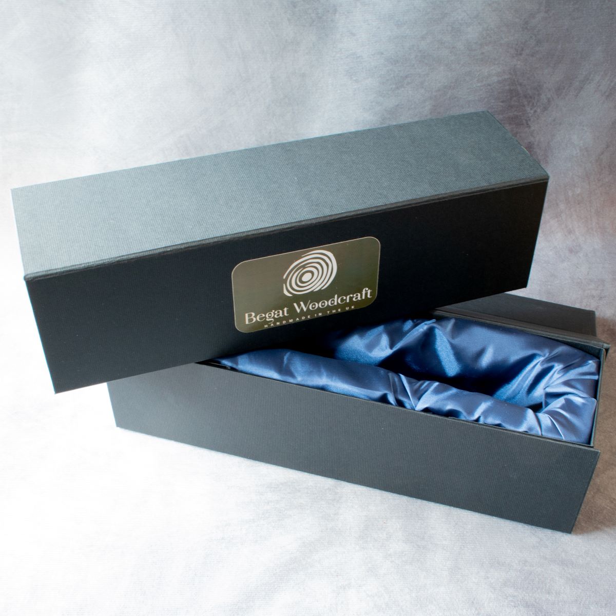 Gift box packaging showing blue silk lining