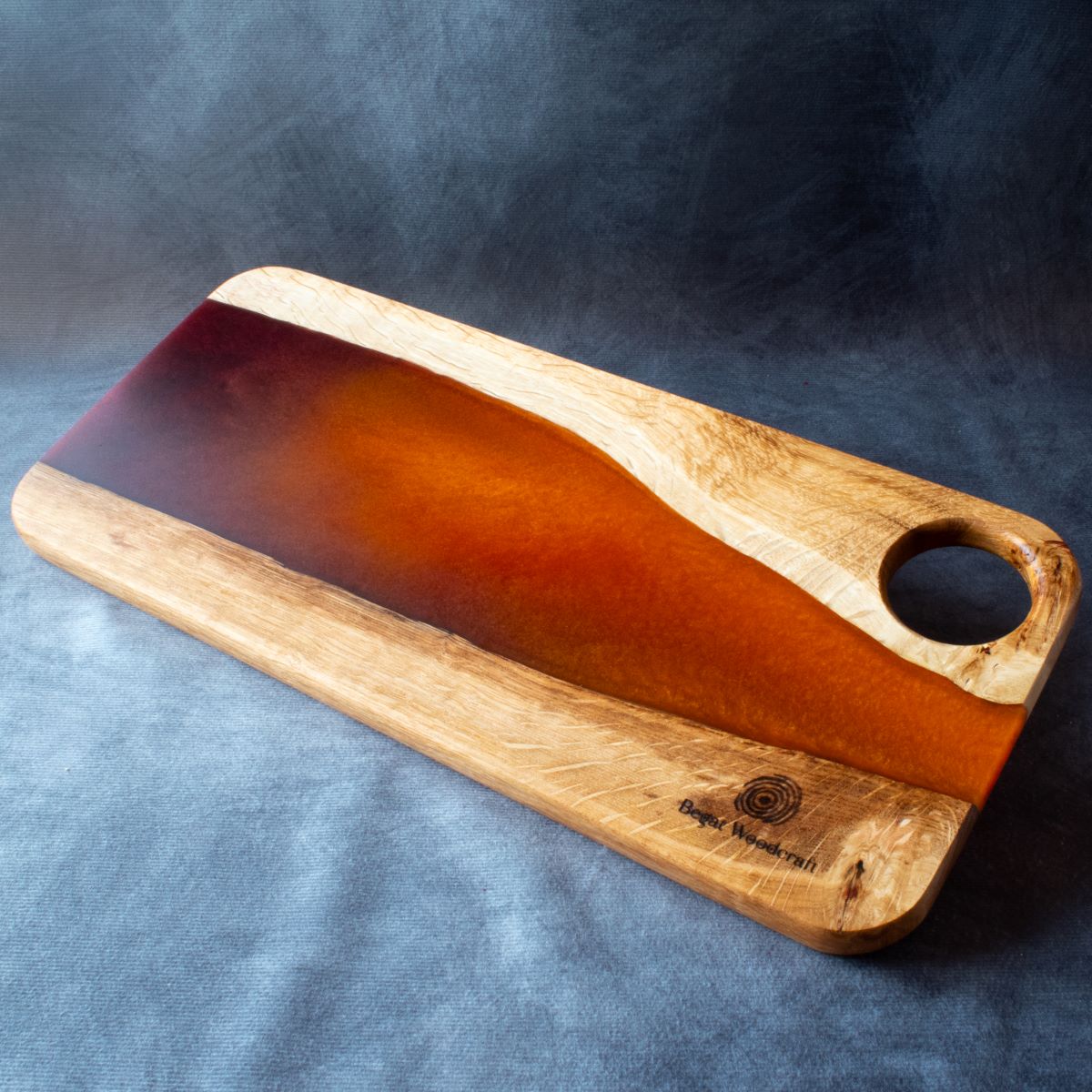 Medium charcuterie board in english oak with orange and red resin viewed from the top