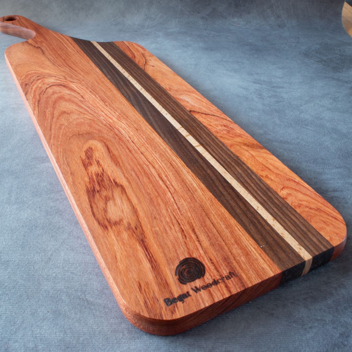 Charcuterie board in African Rosewood & Walnut viewed from bottom edge