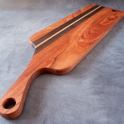 Charcuterie board in African Rosewood & Walnut viewed from handle end