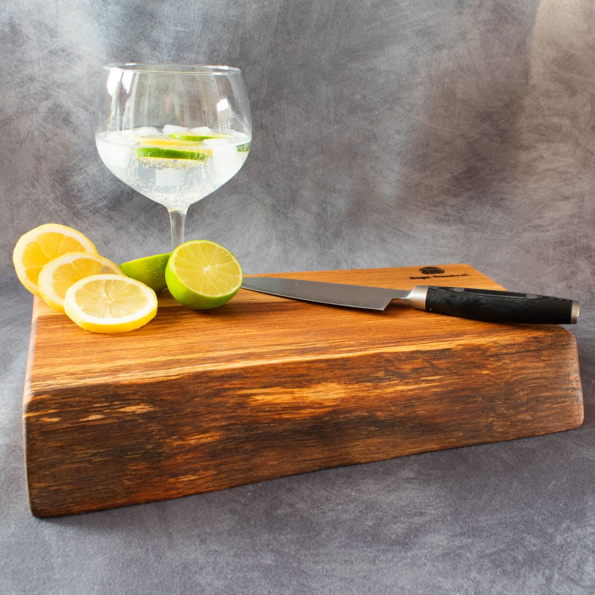 English oak cocktail board with lemons and limes