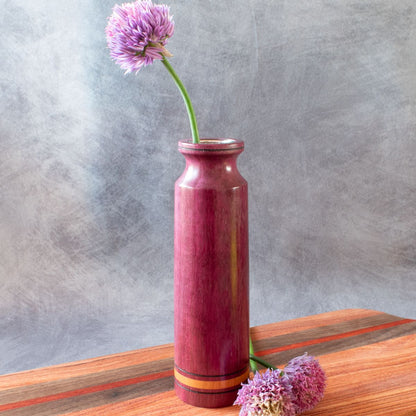 Purpleheart bud vase shown with chive flowers