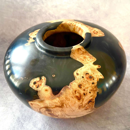 Detail of small opening on Mappa Burr hollow form showing black resin contrast and wall thickness