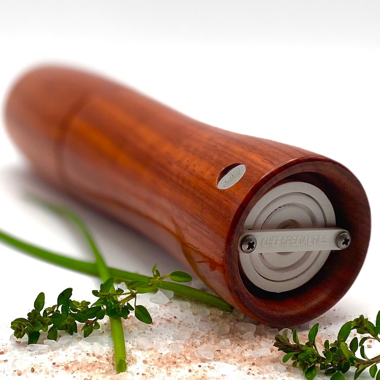 Bottom view of padauk salt mill showing the grinding mechanism