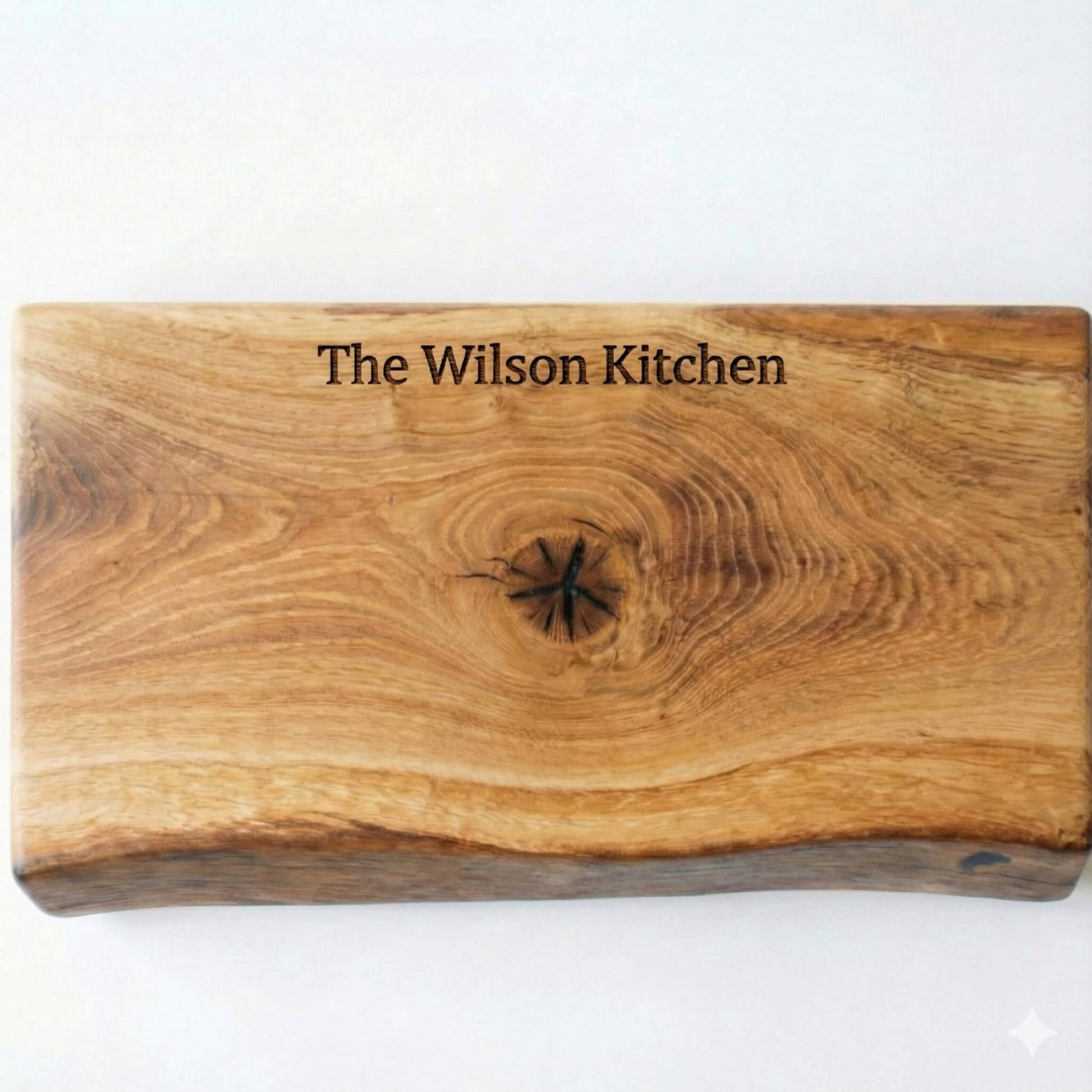 handmade oak chopping board showing laser engraved text in the middle
