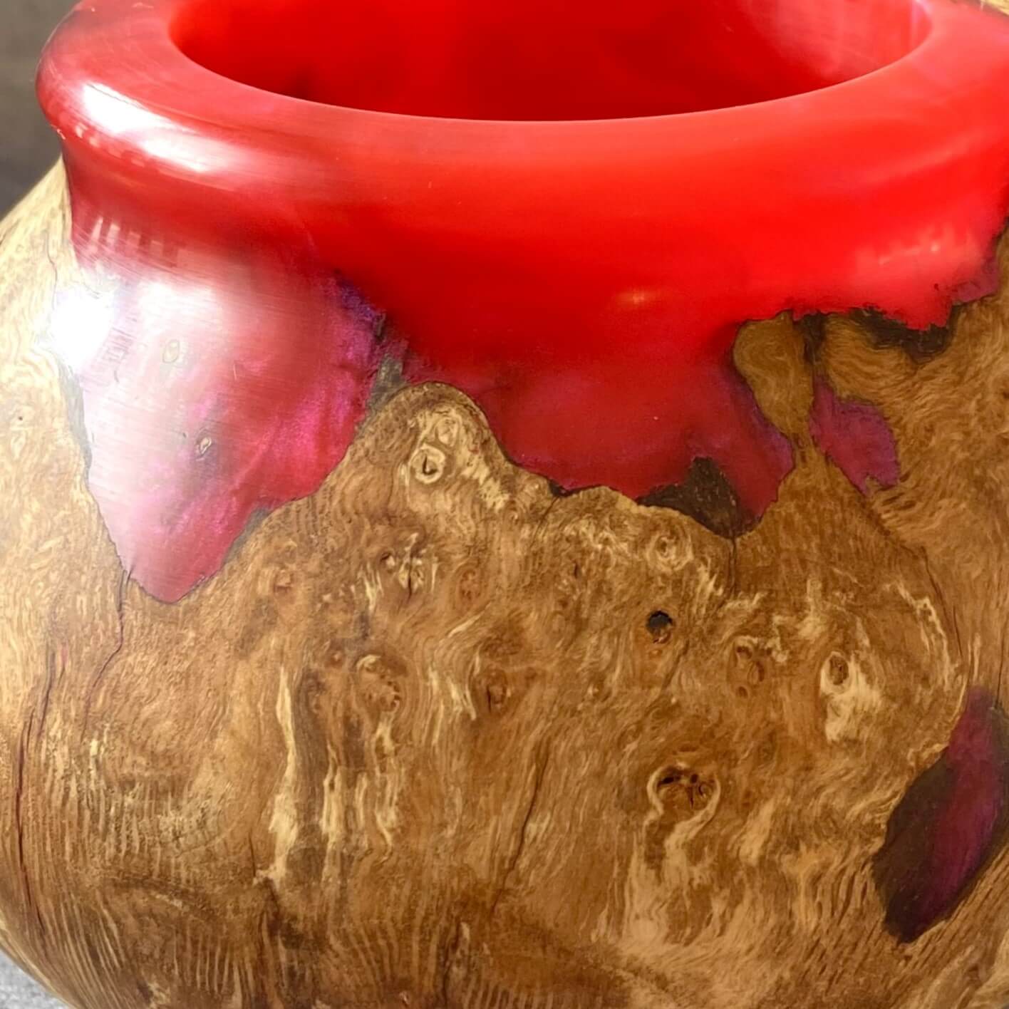 Close up texture of English Burr Oak grain meeting translucent scarlet red resin