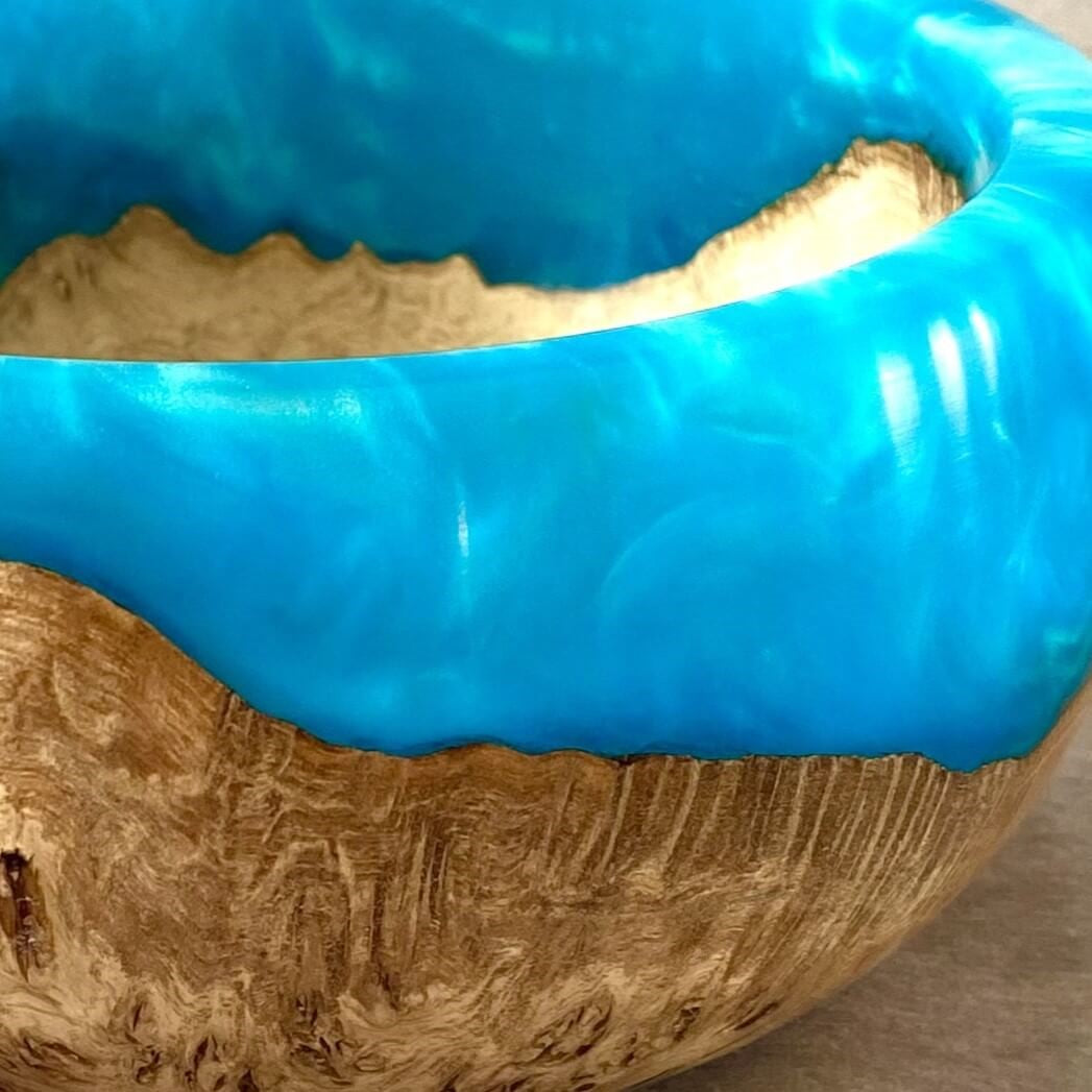 Close up detail of English Burr Oak grain and turquoise resin fusion