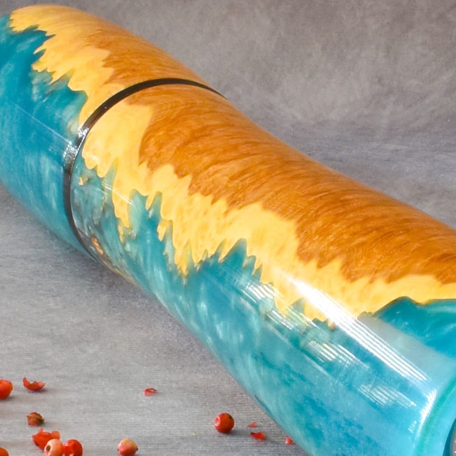 Close up texture of Red Mallee Burr grain meeting turquoise resin