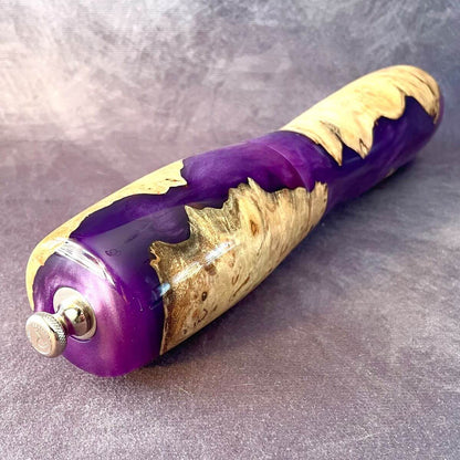 Top view of close up of purple resin and mappa pepper grinder showing adjustment knob