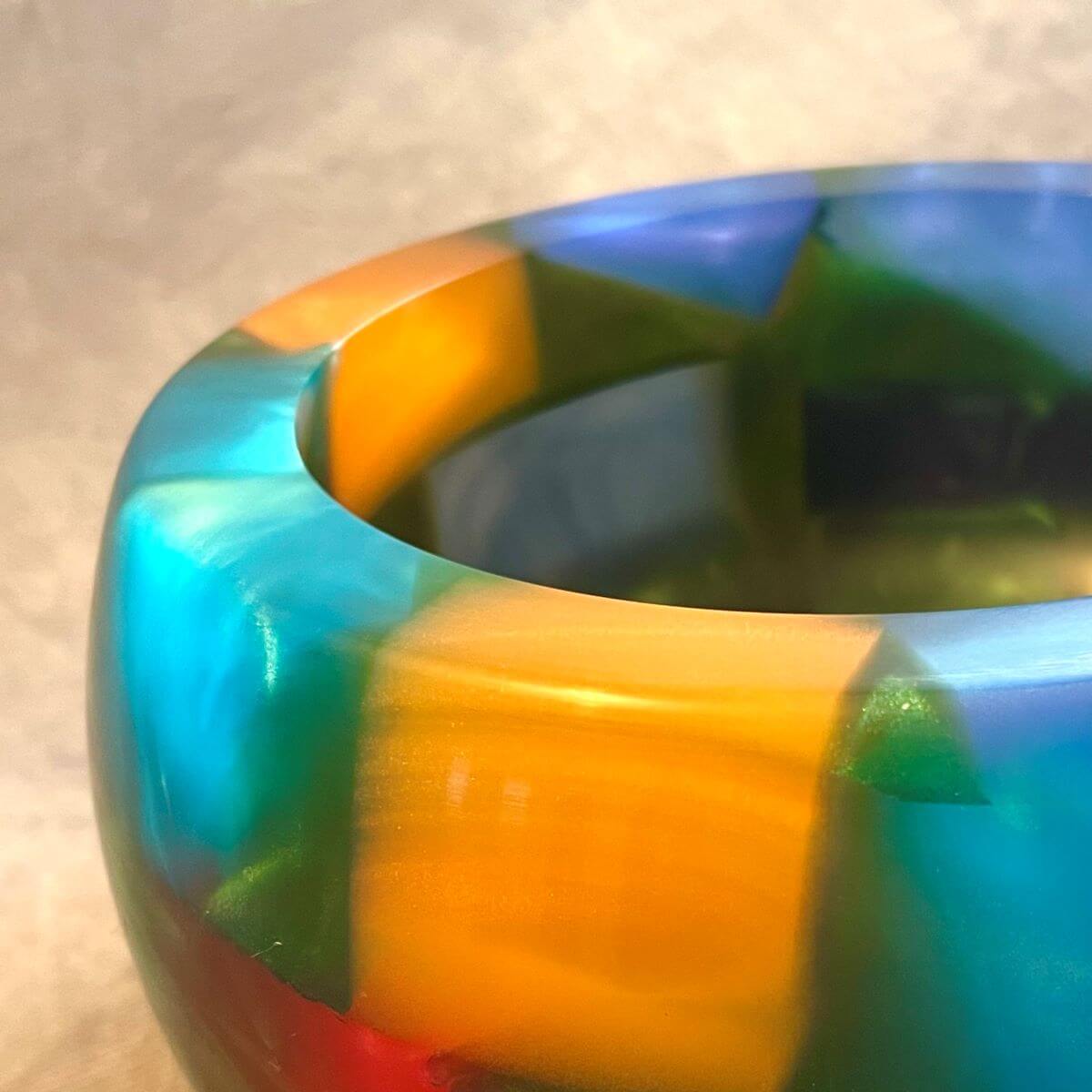 Close up detail of translucent green resin and coloured blocks