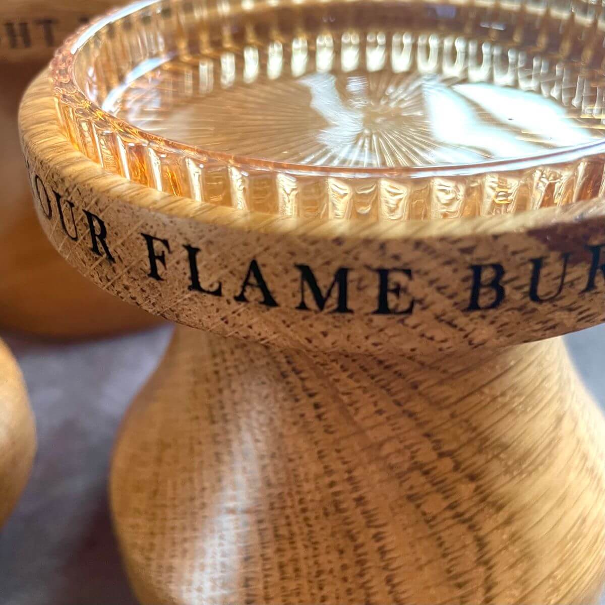 Close up detail of deep laser etching on solid oak, perfect for a 5th wedding anniversary gift.