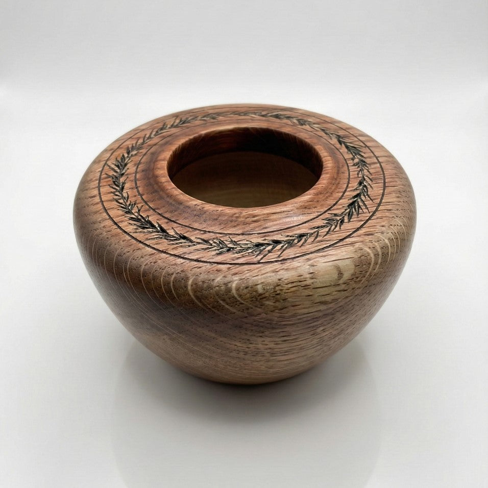 Handmade English Oak Hollow Form 130mm front view with leaf engraving made in Yorkshire