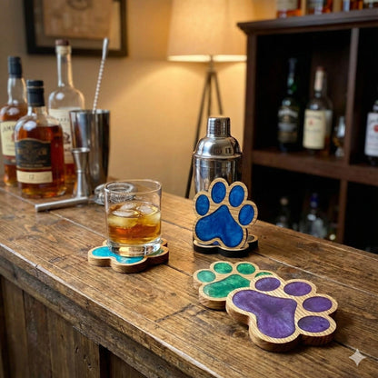 handmade various colours resin and wood pawprint coasters on bar with drinks artisan decor gifts uk