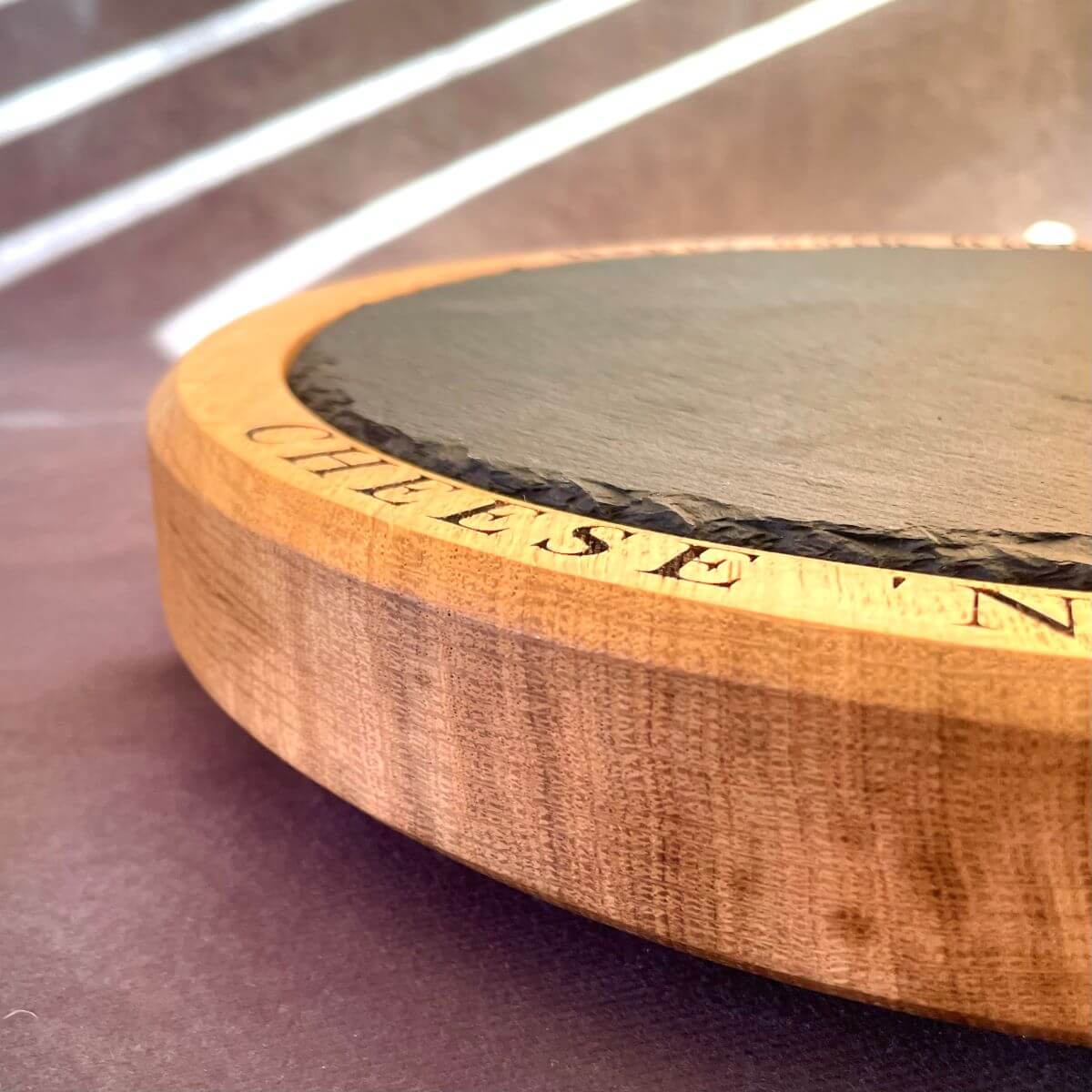 Edge profile of 300mm oak board showing 3 non-slip rubber feet for stability on kitchen counters.