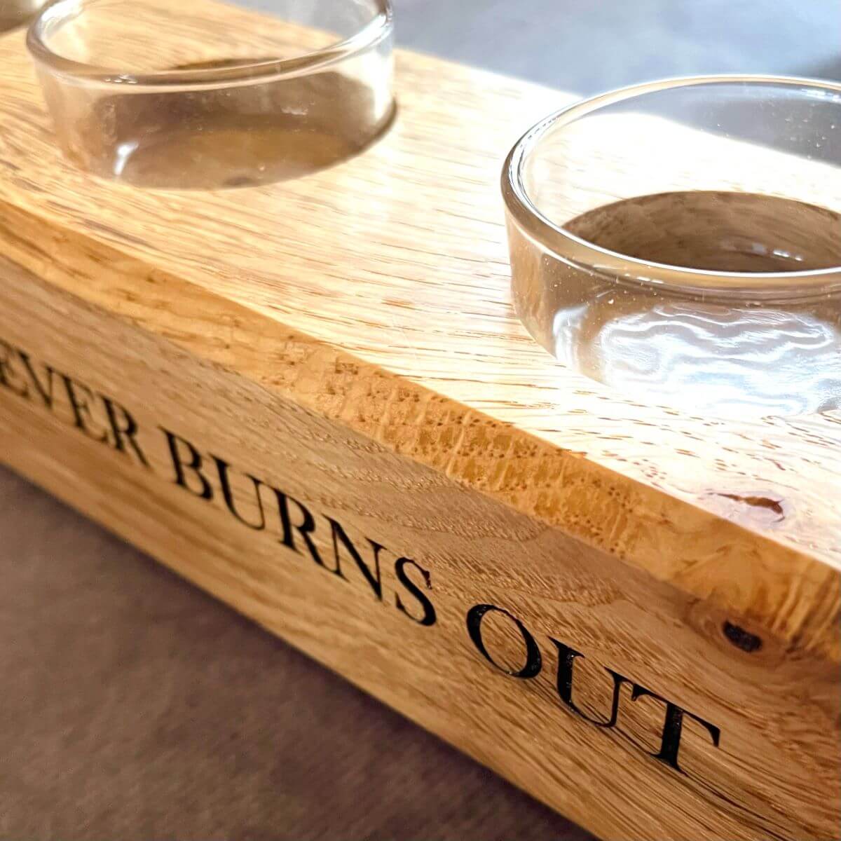 Close up of deep laser engraving on English Oak tealight candle holder