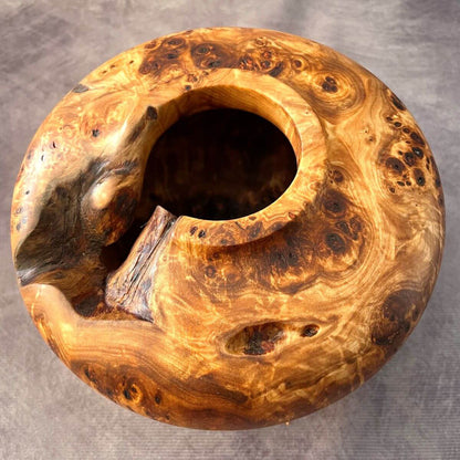 Top view showing the natural voids of this hand turned Mappa burl luxury wood sculpture.