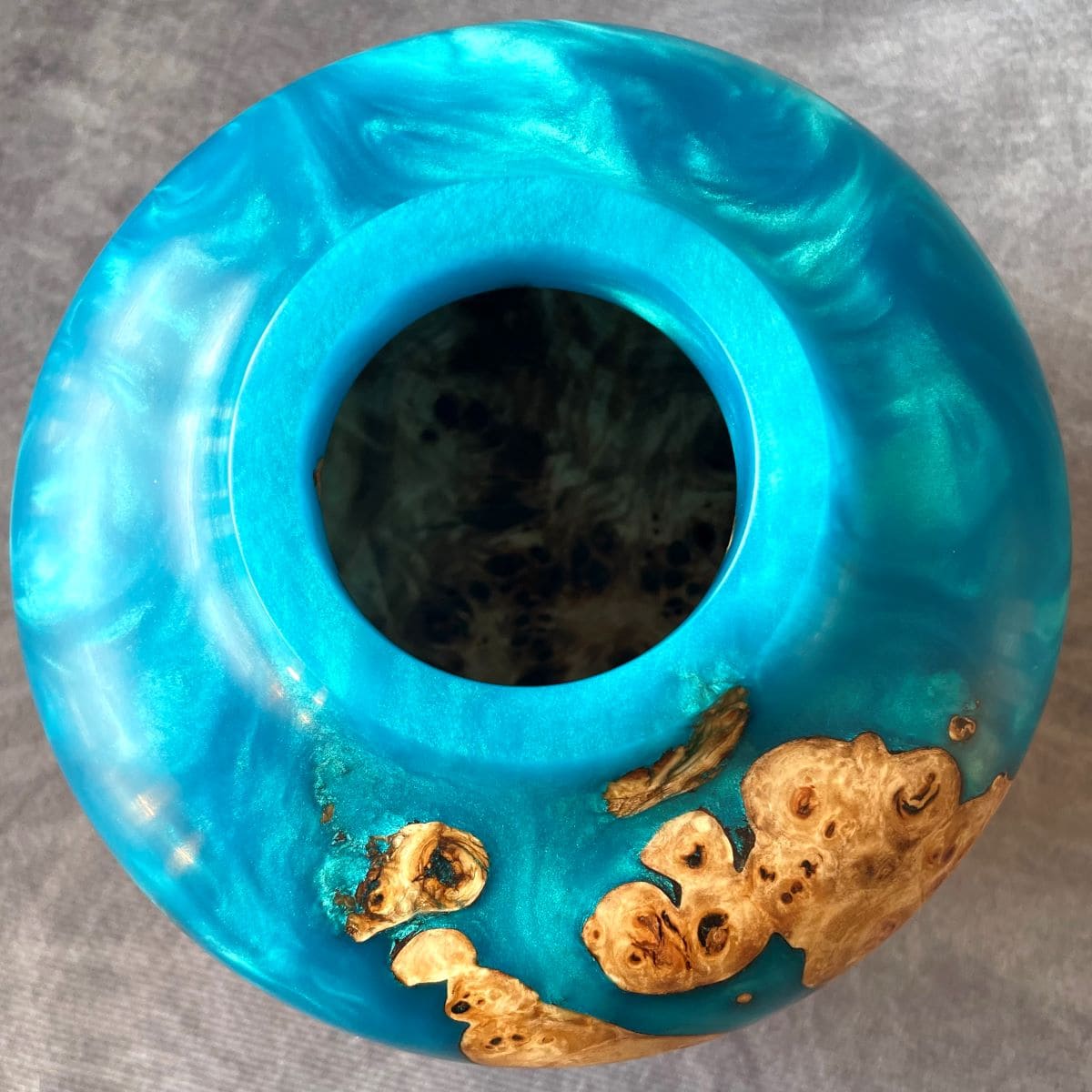 Overhead top view of art vessel showing interior grain and turquoise resin