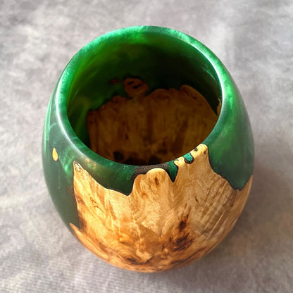 Overhead top view of turned art showing interior wood grain and resin blend.
