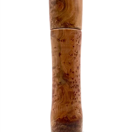 Video of thuya burr pepper mill rotating on turntable