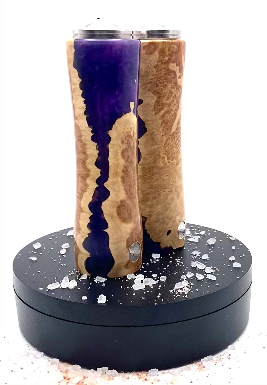 Video of salt and pepper shaker set in mallee burr with purple resin rotating on turntable