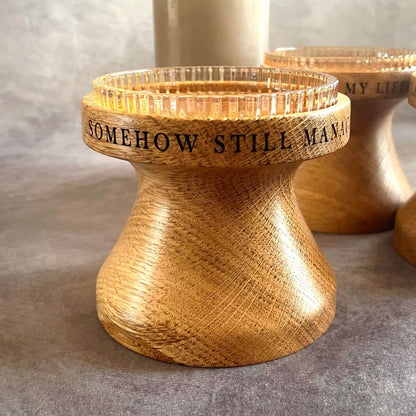 Close up detail of deep laser etched  amusing message on solid oak pillar candle holder, perfect for a 5th wedding anniversary gift.