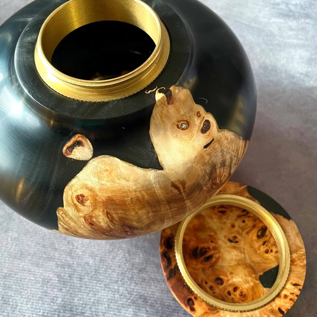 Close up showing the secure brass ring on this threaded lid hand turned pet urn uk.