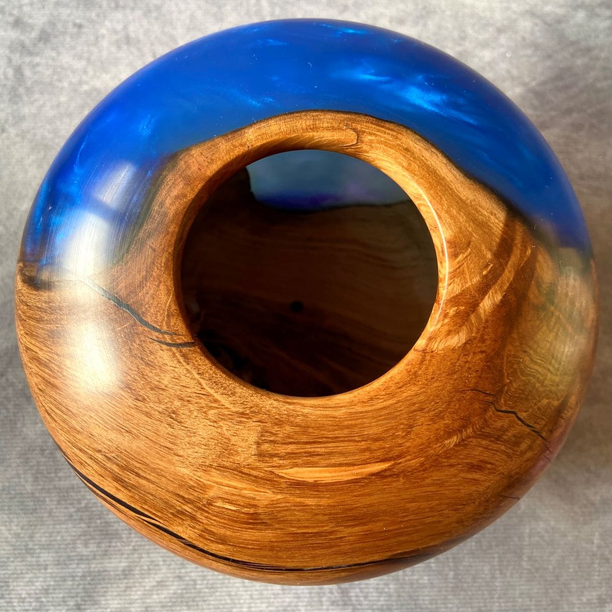 Detail of small opening on Apple Wood hollow form showing cobalt resin depth