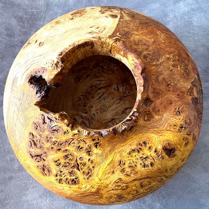 Top view of hand turned wooden vessel showing the natural edge opening and hollowed interior.