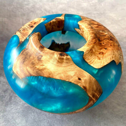 Detail of small opening on Mappa Burr hollow form showing turquoise resin depth