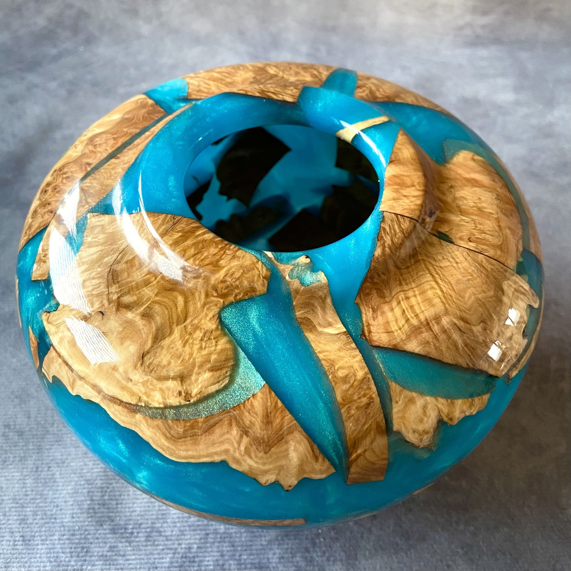 Detail of small opening on Mallee Burr hollow form showing turquoise resin depth