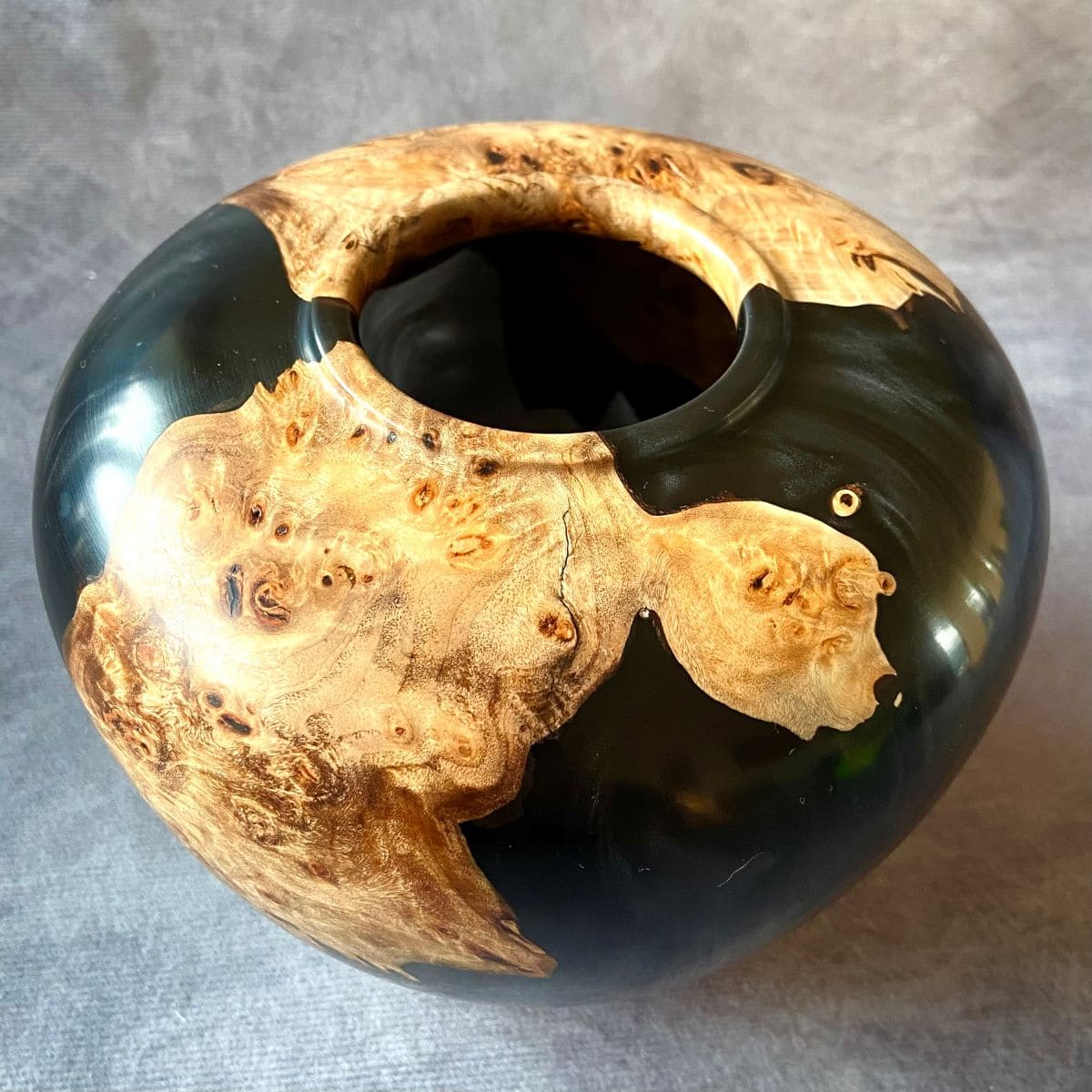 Detail of small opening on Mappa Burr hollow form showing black resin contrast