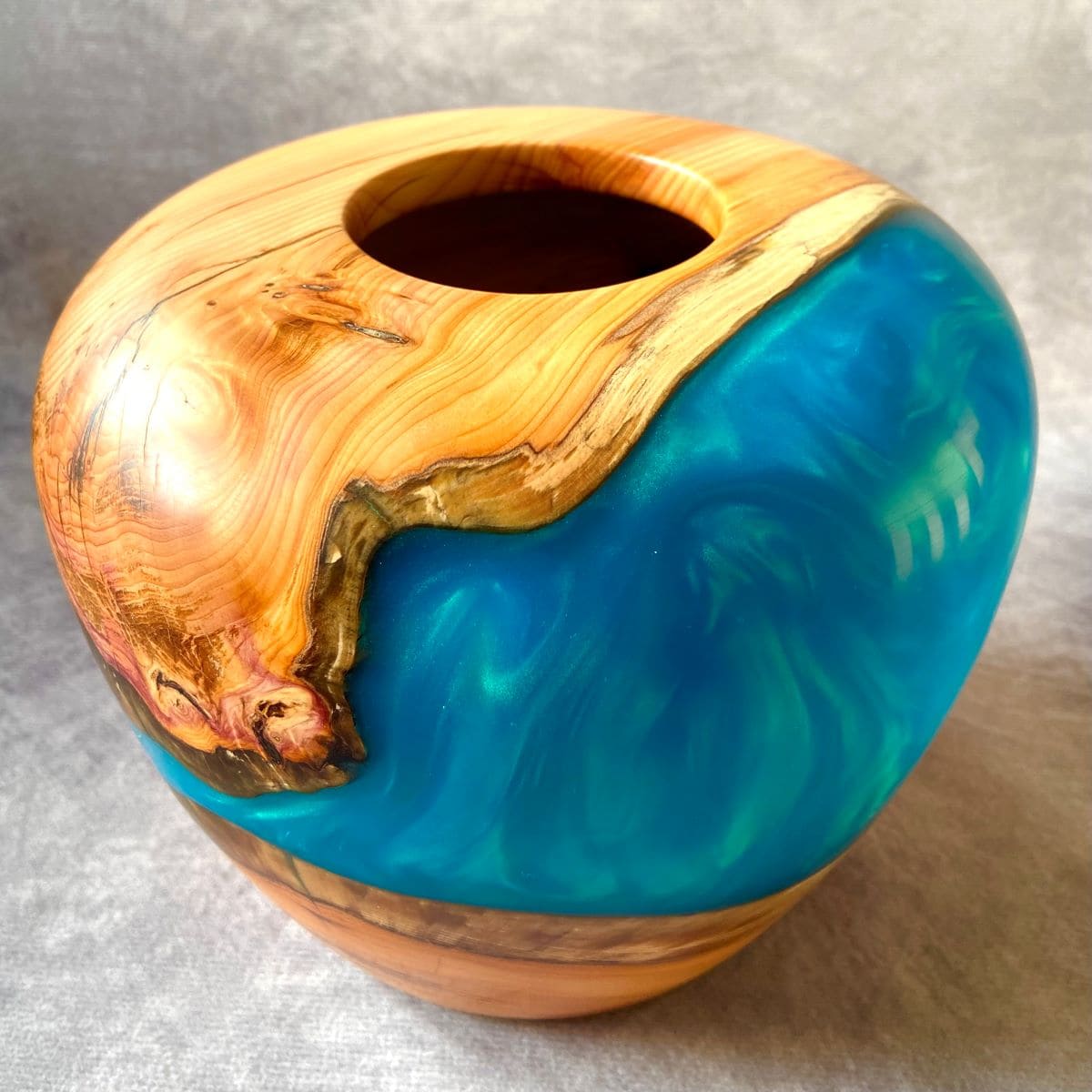 Detail of opening on English Yew hollow form showing turquoise resin depth
