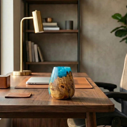 A handmade wood and resin art gift sitting on a modern desk, showcasing beautiful wood art and artistic woodturning.