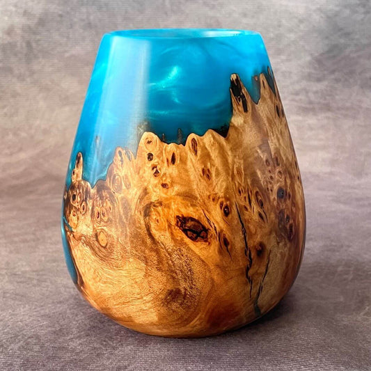 A 120mm tall Mappa burr and turquoise wood resin sculpture. A unique, decorative hollow form with vibrant blue resin and natural wood grain.
